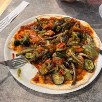 They have a vegan salad and then this pizza which is listed as vegetarian on the menu but is actually vegan  at PPT - L'Aviation - Bar Restaurant de l'aéroport in Faaa