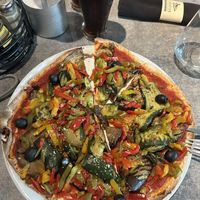 Vegan vegetable pizza, which as big but relatively cold and tasteless. But at least we had something before our flight 🤷🏻  at PPT - L'Aviation - Bar Restaurant de l'aéroport in Faaa