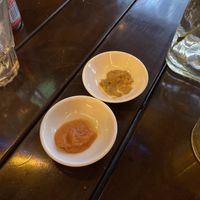 The vegan cheese is the upper one. Underneath is the chilly garlic sauce   at Pizza Lovers in Hanoi