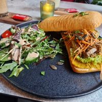 Pumpkin Spice Ciabatta with planted meat and salad on the side at greenhouse Café & PopUp in Esslingen