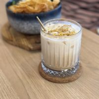 Osmanthus Latte with the vegetarian curry mee in the background   at Mangga Vegetarian Cafe - 美佳素轩  in Seri Kembangan