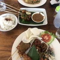 Satay tempeh in the middle, mie goreng at the top and nasi campur at the bottom  at Healthy Warung in Gianyar