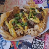Tutu Mary's Vegan Curry Pork Loaded Fries

Mom's famous waffle fries piled up high with Japanese curry, vegan at Tattooed Mom in Philadelphia