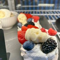 Pavola . Crispy meringue topped with whipped cream and fresh berries.  at Copenhagen European Kitchen & Bakery in Katy