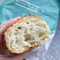 Sliced Couronne bread, perfect inside, crispy crust. at Baguette & Co. in Yerevan