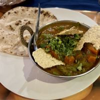 Authentic vegan Indian Food with vegetable in a spicy sauce. Chapati beside .  at Kohinoor Indian Restaurant in Koh Samui