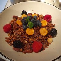 Granola with plant milk on the side at Café Goldener Papagei in Vienna