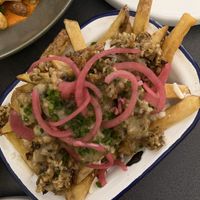 Haggis loaded chips with peppercorn sauce, cheese & pickled onions  at Nooch Bar and Kitchen in Stirling