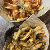 Patatas bravas y tiras de cebolla  at Karpanta in Sevilla