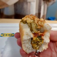 Vegan hot dog with ketchup, pickles and roasted onions at IKEA in Hanau