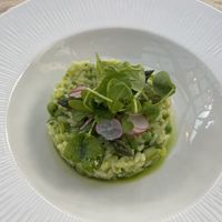 Risotto with fresh asparagus, garden peas, and broad beans. Creamy and flavorful.    at The Manor House Hotel in Moreton-in-marsh