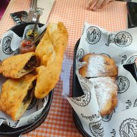 dark chocolate pişi, mushroom and cheese pişi; and plain pişi with jars of jam, olives, and sundried tomato sauce at Pişiköy in Istanbul