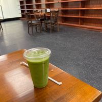 Seating inside, w/ vegan smoothie at Hungry & Healthy Marketplace in New York City