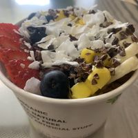 Acai bowl with granola, coconut, bananas, strawberries and blueberries   at RawASF in Elk Grove