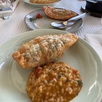 Three pies in one order alongside a cauldron of piping hot tomato ricee  at Belém 2 a 8 in Lisbon