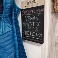 Some signs offering vegan options for camperos at Granjero Busca Campero in Madrid