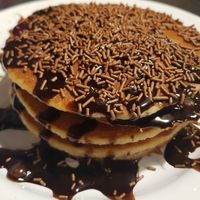 Pancakes with chocolate sauce and sprinkles at V Rev Vegan Diner in Manchester
