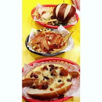 Chilli dog with pizza fries at V Rev Vegan Diner in Manchester