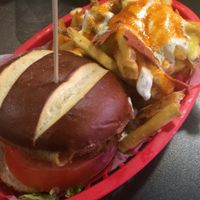 Burger with buffalo loaded fries at V Rev Vegan Diner in Manchester
