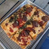 Build your own 4 square with vegan cheese, vegan sausage, and both red and pesto sauce stripes at R Town Pizza in Reno
