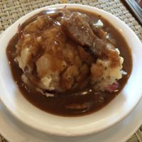 mashed potatoes in a brown mushroom gravy at Detroit Vegan Soul - East in Detroit