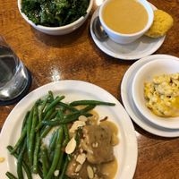 Tempeh and gravy meal, side of Mac and cheese, sweet potato Curry soup, and kale salad with sesame seeds.  at Detroit Vegan Soul - East in Detroit