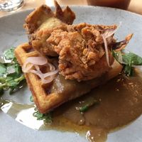 Southern Fried Artichokes, House Waffle, Pickled Shallots, Bourbon Maple Syrup and Mushroom Red-Eye Gravy. at The Acorn in Vancouver
