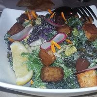 Kale Salad, Tempeh, Smoked Paprika Croutons, Crispy Capers, Black Olives, Caesar Dressing at The Acorn in Vancouver