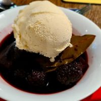Poached pear and blackberries in a cassis sauce with vegan ice cream at The Fromeway in Radstock