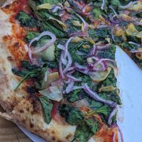 The 12-inch veggie pizza with nondairy cheese. at Doughbaby - Pop-up in Lakeport