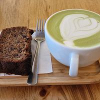 Matcha latte and banana cake at Rocanini Coffee Roasters in Vancouver