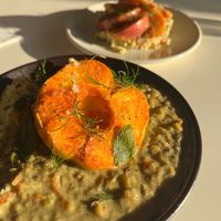 Front: warm millet salad with green lentils and oven baked apple. at Klorofüll in Tallinn