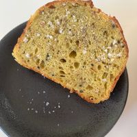 Homemade bread with coriander and salt flakes. at Klorofüll in Tallinn
