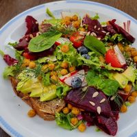 Avocado with beetroot on rye bread with salad at Klubokawiarnia Mleczarnia in Wroclaw