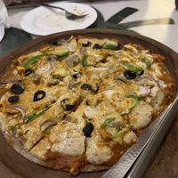 Pizza with vegan cheese   at Millets of Mewar - City Palace Rd in Udaipur