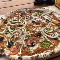 Veggie pizza without cheese   at Green Restaurant in Vang Vieng