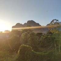 Sunset view with motor paragliding at Green Restaurant in Vang Vieng