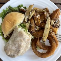 (All portions split in half): Preposterous burger, chickun caesar wrap, onion rings, and chickun bacun ranch poutine  at Odd Burger in Calgary