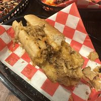 Seitan cheesesteak in front, small piece of Nashville hot left in back lol   at Algorithm in Philadelphia