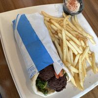 Falafel wrap with fries and side of hummus  at Luna Grill in Richardson