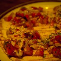 The tomatoes (with spices and tahini) on toasted flat bread.  at Salterio in Barcelona
