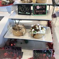 Display with featured local/special rolls  at Cinnaholic in Gallatin