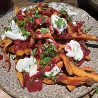 Sweet potato fries with beetroot ketchup and vegan sour cream   at Honest Greens - Caleido in Madrid