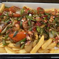 Chorrillana Titanica - Loaded fries covered in an assortment of vegetables.  at Schopdog in Arica