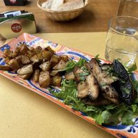 Vegan portobello “tagliata” with potatoes   at Anarres Libreria-Bistrot in Milan