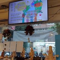 Watching SupremeMaster TV... at Loving Hut 愛家 - QingZhong St in Tainan