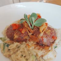 Bean meatballs on orzo with spring vegetables at Vita Rama in Sofia