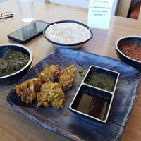 Tofu saag, pakoras and mushroom vindaloo, half eaten as we couldn't wait! at Great Taste Indian and More in Highlands Ranch