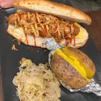 Doggo - vegan hot with Future farm sausage, ketchup, mayo, onions. Jacked potato and sauerkrauts   at La Forgia degli Eroi in Milan