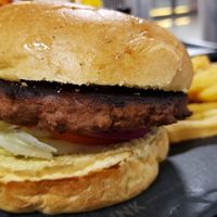 Vegan burger (R$69). Nice bun. Pretty good on a whole. at GRU - Living Heineken - T3 in Sao Paulo